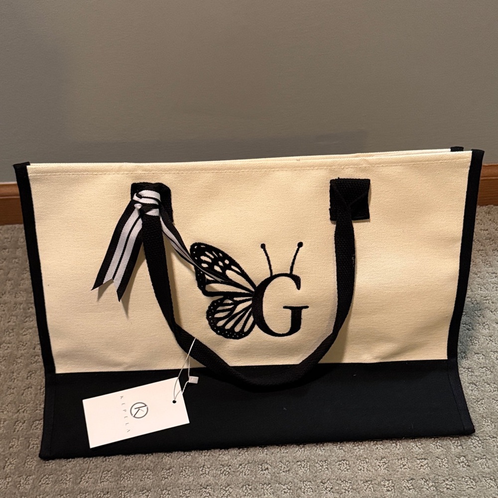 NWT Kepela Black and Cream “G” Butterfly Tote
